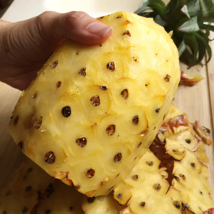 Removing the Skin Slice off the Skin from Top to Bottom of Pineapple